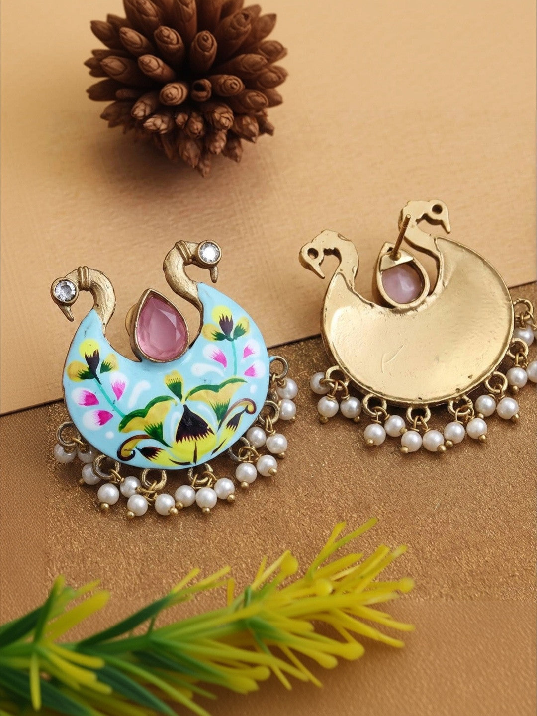 Front and back view of meenakari peacock earring showing gold-plated reverse side