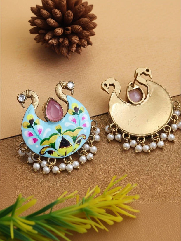 Front and back view of meenakari peacock earring showing gold-plated reverse side