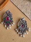 Front and back view of oxidised peacock earrings showing push-back stud fitting