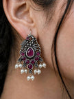 Oxidised silver peacock chandbali earring worn on ear with fuchsia stones and pearl drops