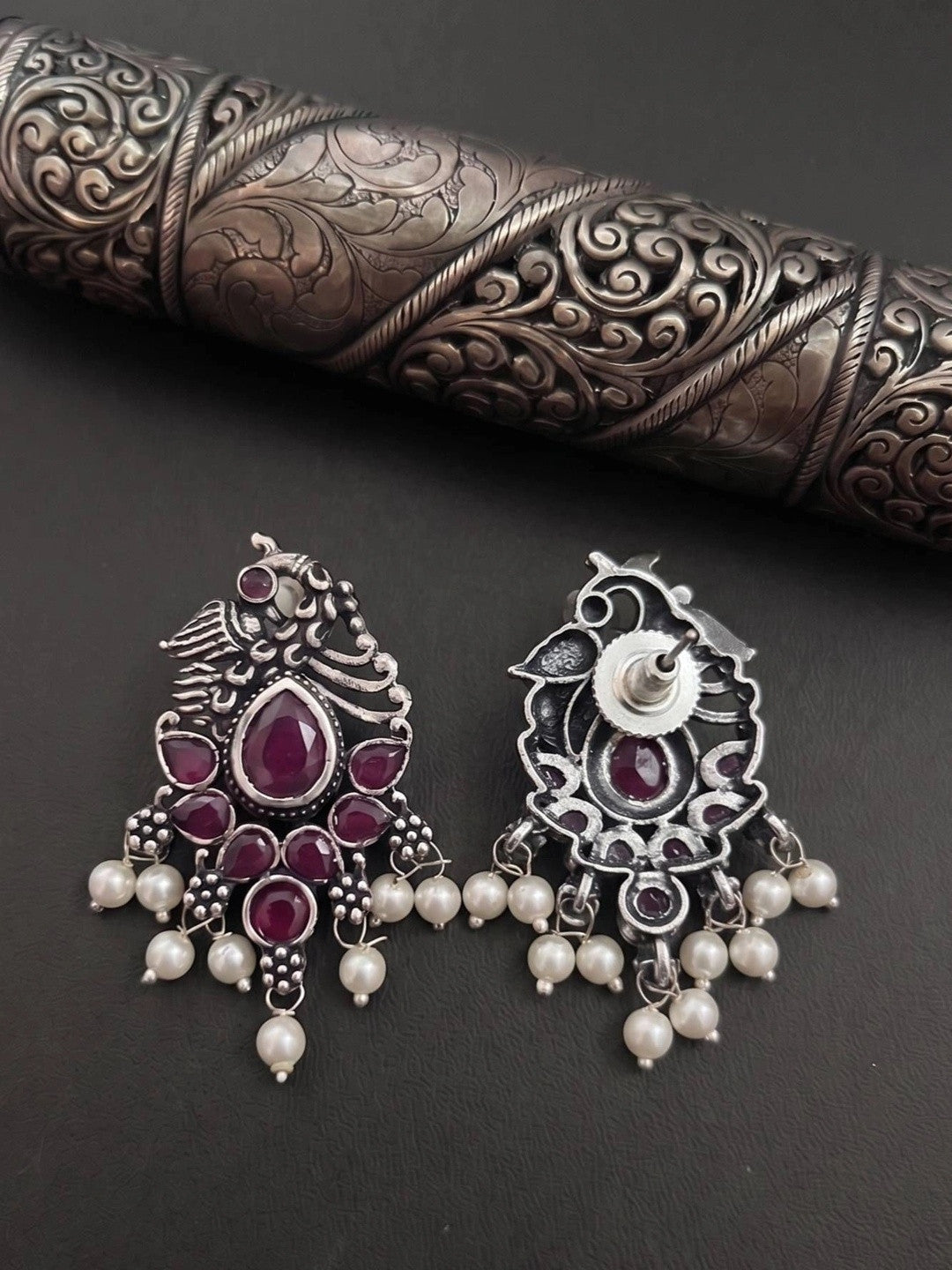 Front and back view of oxidised silver peacock earrings showing hook and reverse detail
