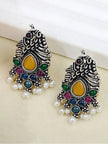 Pair of oxidised silver peacock earrings side by side showing yellow teardrop centre stone and pearl fringe