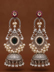 Front-facing pair of oxidised silver jhumka earrings with pink kundan tops, arched chand frame and domed ghungroo-fringed bell on brown background
