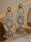 Both jhumka earrings displayed upright on a wooden jewellery stand against a neutral background