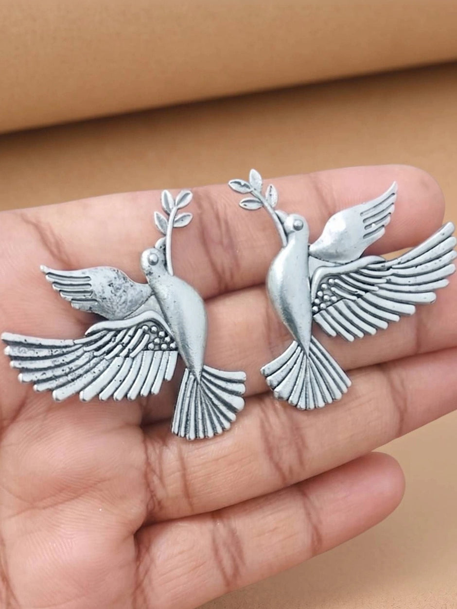 Pair of oxidised silver dove stud earrings with olive branch held in open palm