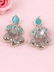 Pair of oxidised silver jhumka earrings front and back view on pink fabric