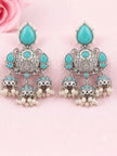 Close-up pair of triple jhumka earrings with turquoise stones and pearl bead drops