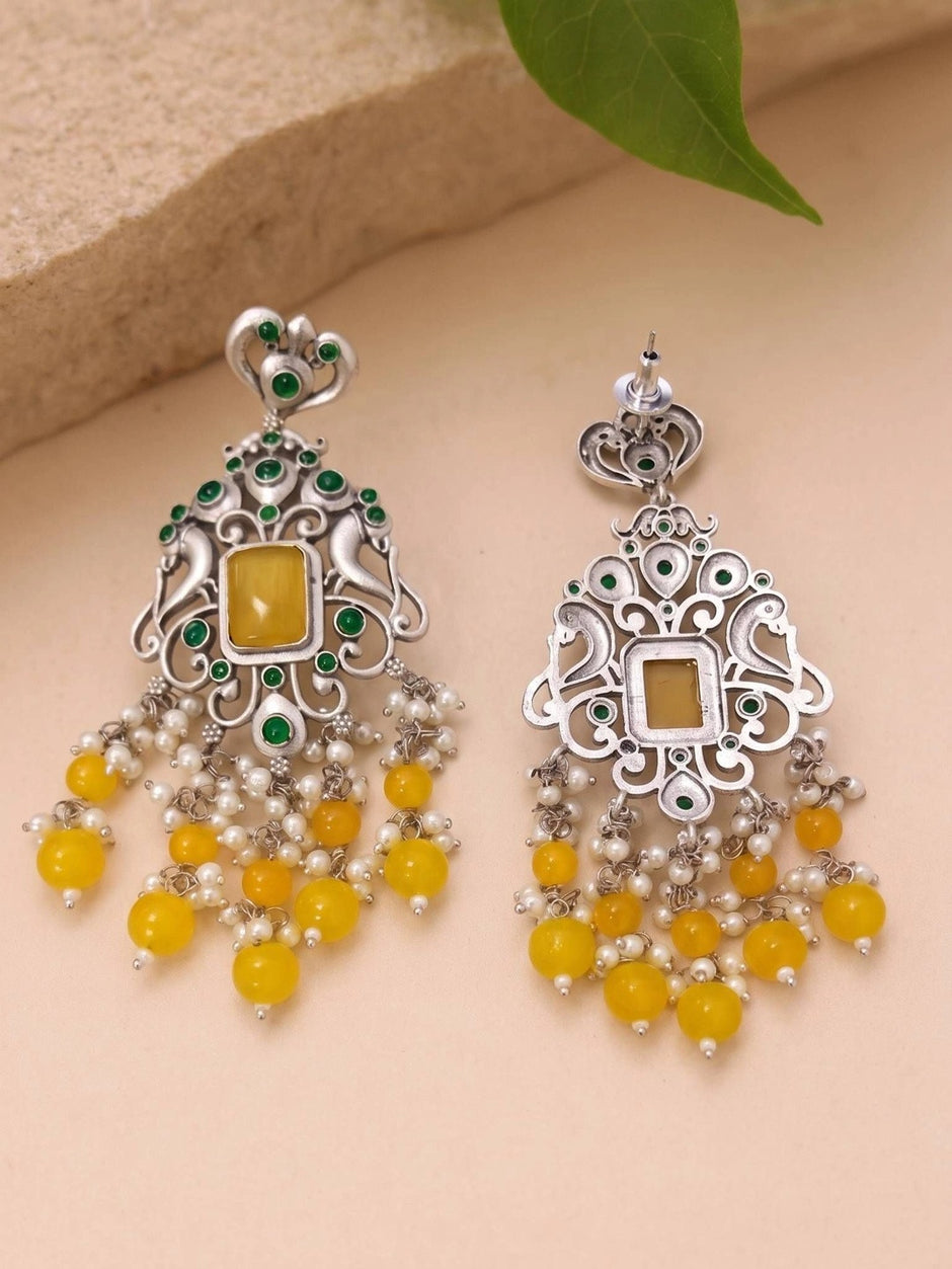Front and back view of oxidised silver chandbali earrings showing push-back stud closure