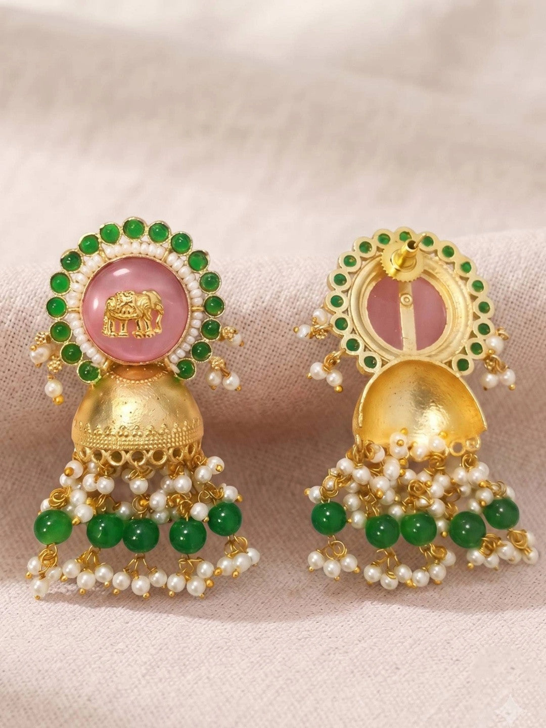 Front and back view of jhumka pair on fabric, showing push-back stud fitting and domed bell