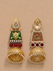 Front and back view of one jhumka earring on beige surface, back reveals red and green meenakari reverse detailing