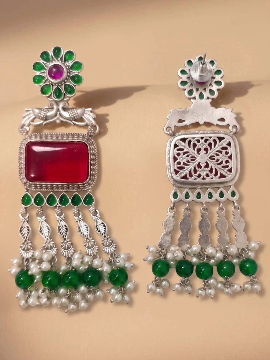 Front and back view of oxidised silver chandbali earrings showing filigree reverse side and stud post