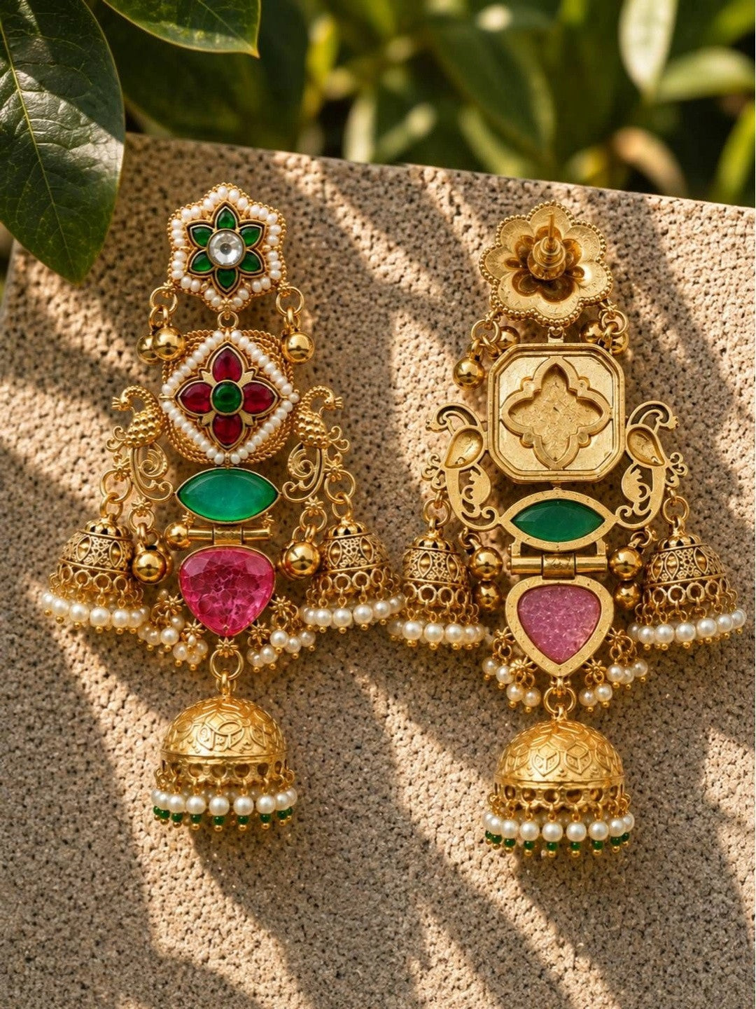 Front and back view of one kundan jhumka earring side by side showing reverse gold-tone engraved detail