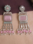 Front and reverse side of oxidised silver chandbali earrings showing stud back and engraved tassel detailing on a fabric surface