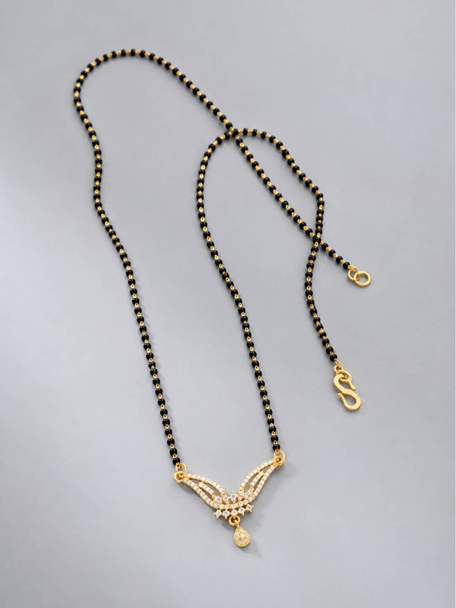 Full length flat lay of black bead mangalsutra showing S-hook clasp and CZ pendant