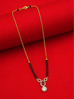 Full-length view of gold-plated black bead mangalsutra laid flat on red fabric showing lobster clasp and full chain length