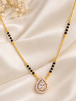 CZ mangalsutra with black bead chain and teardrop pendant laid flat on cream satin fabric