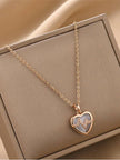 Rose gold heart pendant necklace with CZ heartbeat motif displayed in a beige jewellery box