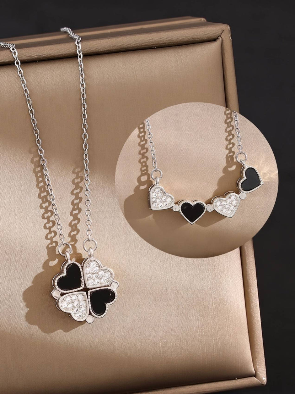 Left view shows four hearts folded into a clover pendant shape; right inset shows the same necklace worn as a bar with hearts spread open