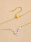 Flat lay of necklace showing lobster clasp, extender chain, and marquise CZ pendant from above