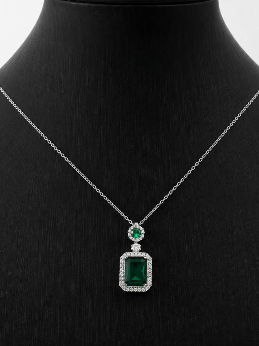 Emerald green rectangular CZ pendant necklace displayed on a black jewellery bust, front view