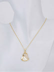 Gold-plated open heart pendant necklace with mother-of-pearl and cubic zirconia accent displayed on a mannequin bust