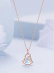 Heart pendant with blue-toned moonstone cabochon and pavé crystal wing on rose gold chain