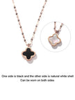 Side-by-side product shot showing black inlay front and natural white shell reverse of clover pendant