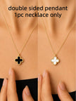 Double-sided clover necklace worn on neck showing black onyx side and white mother of pearl side