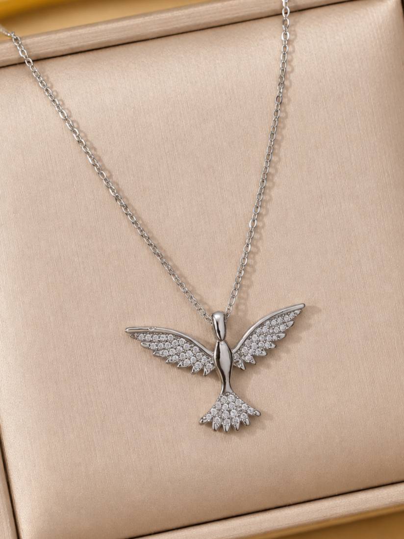 Silver CZ bird pendant necklace displayed flat on a beige jewellery box