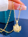 Hand holding gold tulip pendant necklace showing front detail and chain drape
