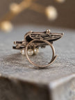 Side view of oxidised silver Mohi ring showing open adjustable band and intricate filigree back detail with small pearl drops