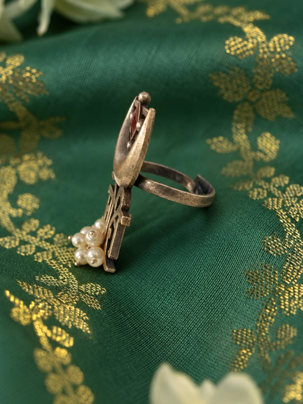 Side profile of oxidised silver Moksh ring showing crescent moon detail, open adjustable band and dangling pearl drops