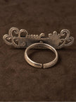 Back view of Nakhrewaali oxidised silver ring showing open adjustable band and reverse of filigree face plate
