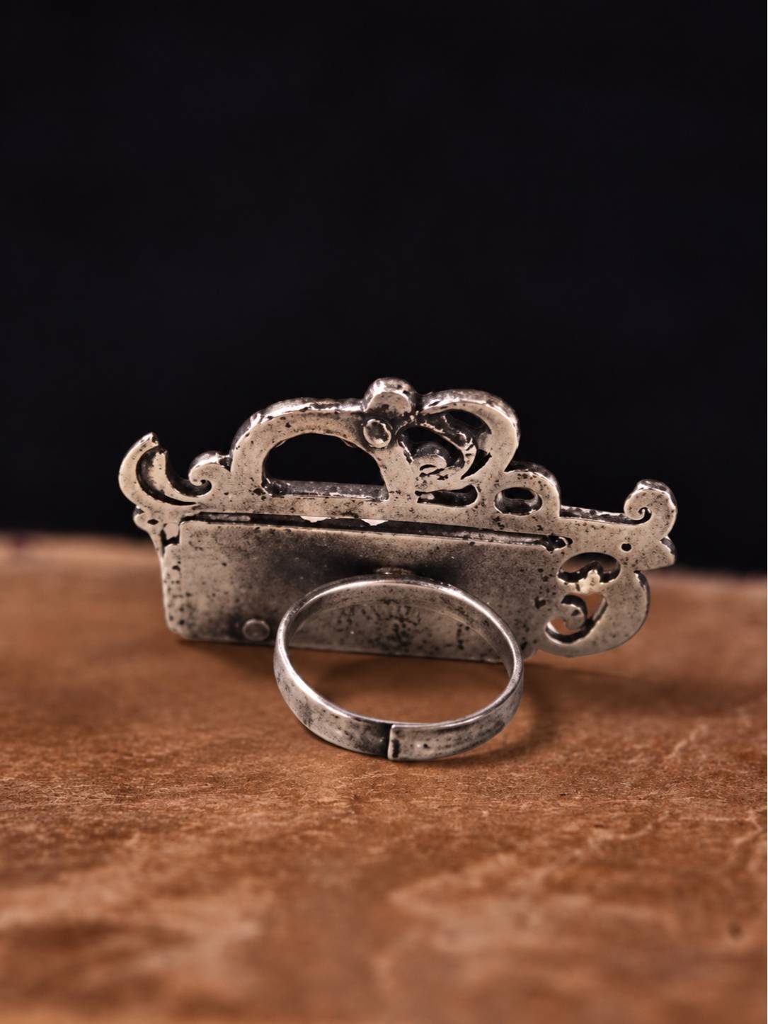 Back view of oxidised silver Radha ring showing adjustable open band and hollow crown construction