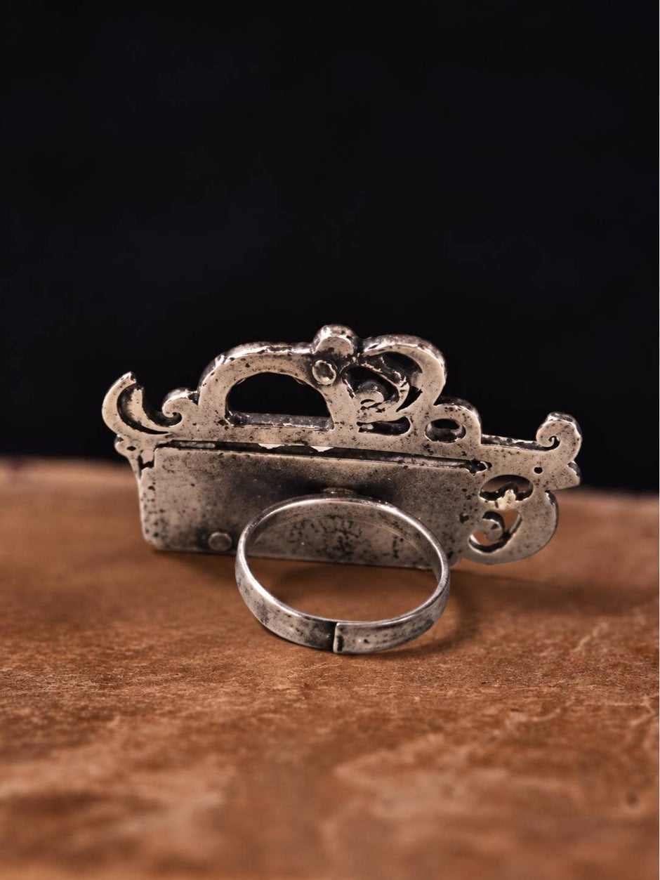 Back view of oxidised silver Radha ring showing adjustable open band and hollow crown construction