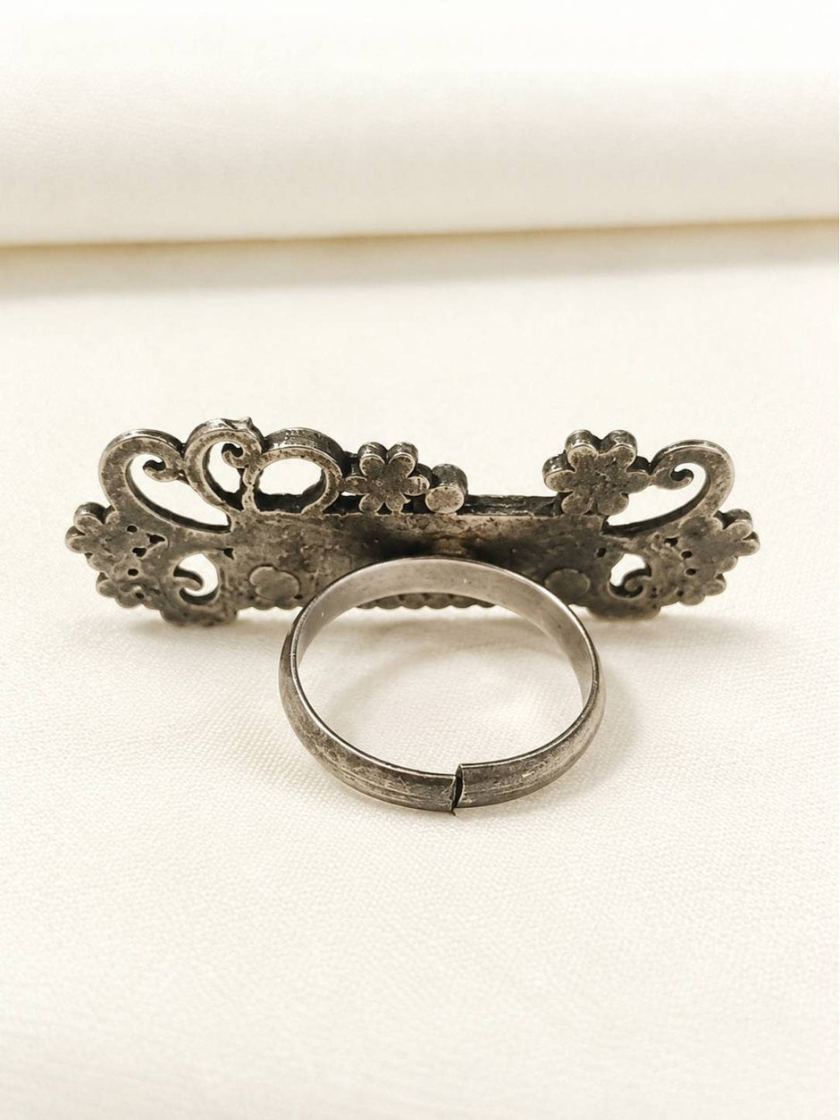 Back view of oxidised silver name ring showing adjustable open-back band and reverse of ornate face
