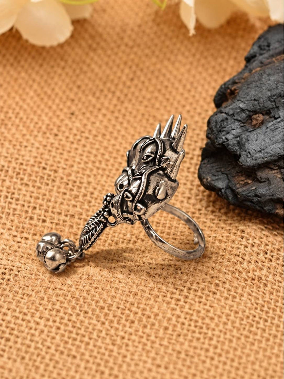 Side profile of oxidised silver horse head ring showing curved drop detail and open adjustable band