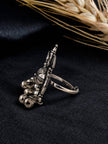 Side profile of oxidised silver ghungroo ring showing adjustable band and layered bell dangles