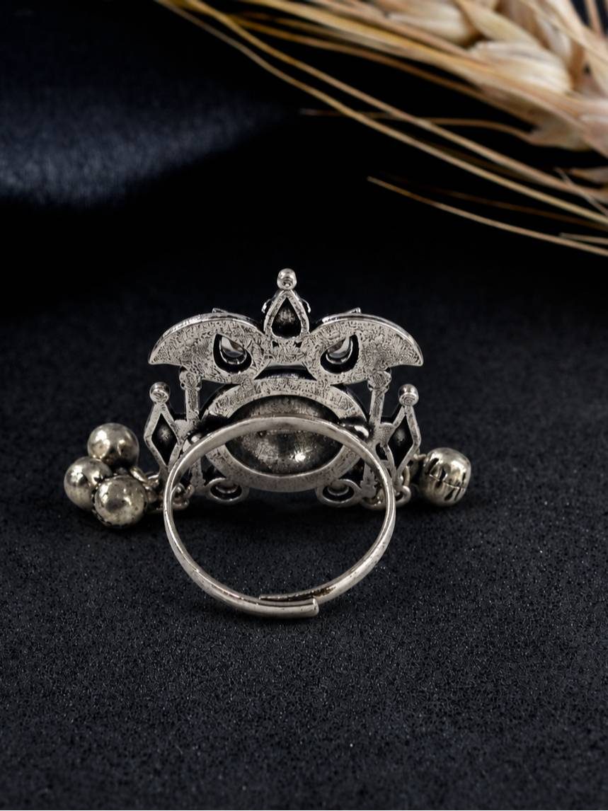Back view of oxidised silver ring revealing open adjustable shank and intricate filigree detailing on the base