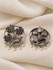 Front and back view of oxidised silver chandbali earrings showing push-back stud closure on cream fabric