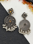 Front and back view of oxidised silver chandbali earring showing lotus engraving and plain reverse side