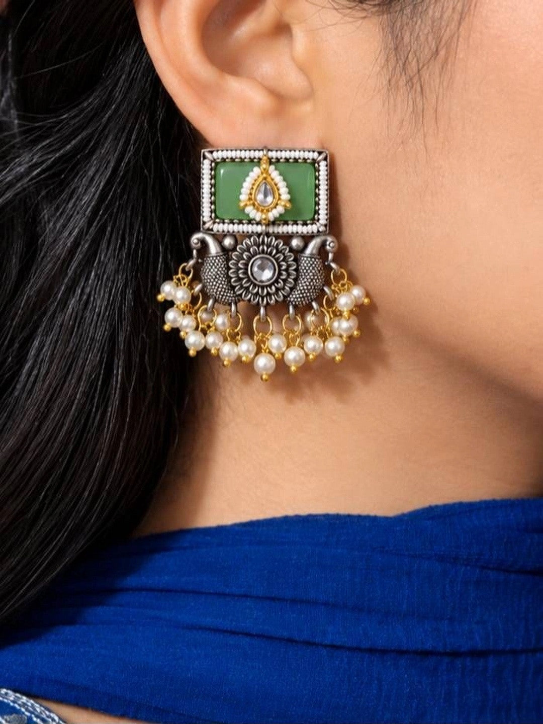 Oxidised silver kundan square drop earring with mint green stone and pearl danglers worn on ear