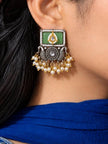 Oxidised silver kundan square drop earring with mint green stone and pearl danglers worn on ear