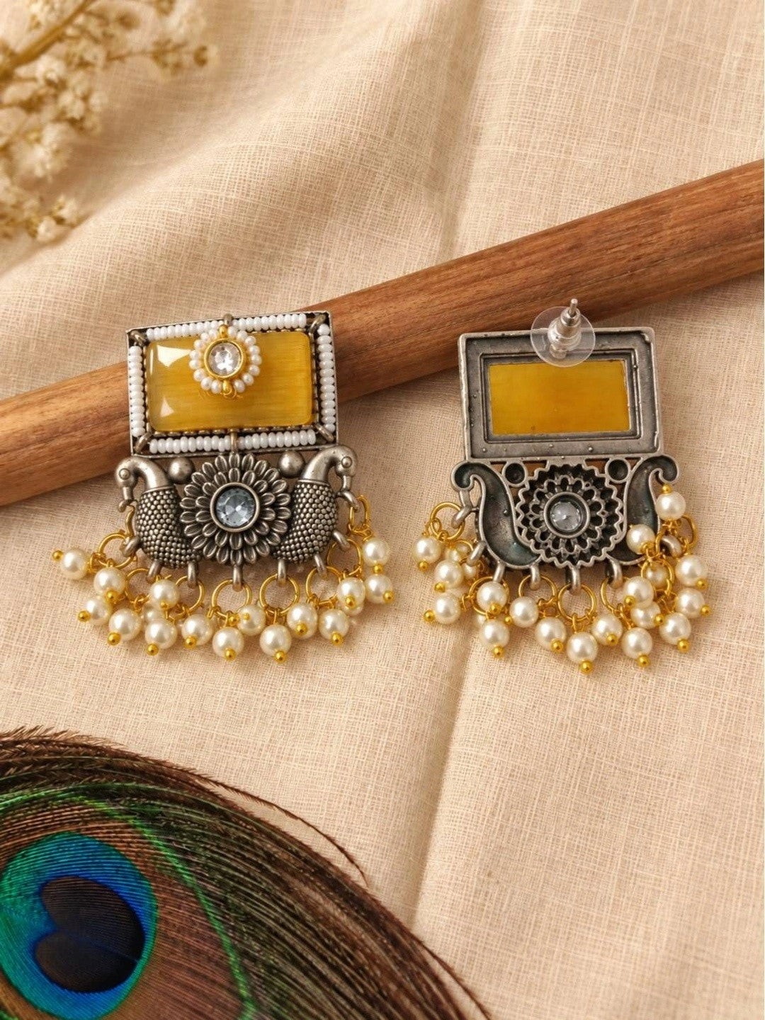 Front and back view of oxidised silver chandbali earrings showing push-back closure and plain reverse side