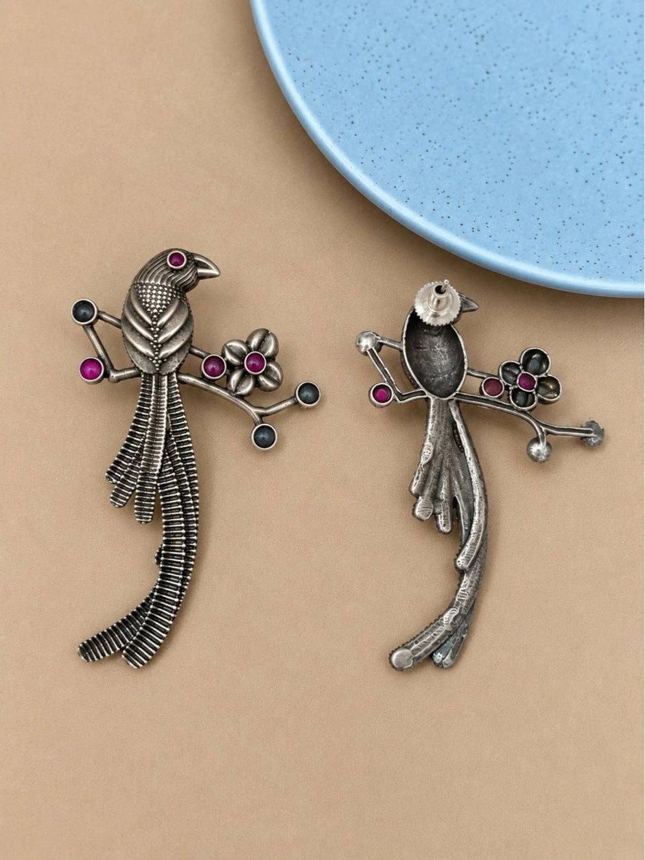 Front and back view of oxidised silver bird earrings showing stud post fastening and reverse detail