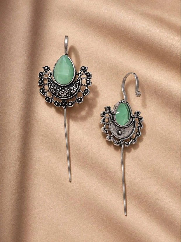 Front and back view of oxidised silver ear cuff earrings with long thread drop on beige fabric