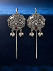 Pair of oxidised silver floral ear cuff earrings with red cabochon stone and pearl drops on blue velvet