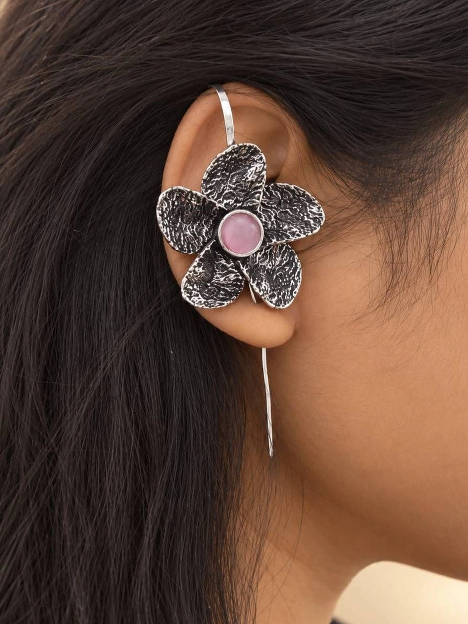 Oxidised silver floral ear cuff earring worn on a woman's ear showing fit and scale