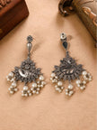 Front and back view of oxidised silver chandbali earrings showing engraved crescent panel and pearl drop fringe