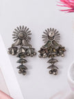 Front and back view of oxidised silver jhumka earrings showing screw-back closure and ribbed petal body